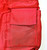 MLB Vintage Philadelphia Phillies Backpack, close-up of the red fabric material with a small external pocket and stitching details.