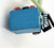 Monster High - Frankie Stein Ornament (2014), close-up of the blue plastic base with embossed text and a painted, striped figurine of Frankie Stein character leaning against a green stem.