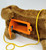 Unbranded Battery Operated Leash Control Dachshund, close-up of the battery compartment on a plush dachshund stuffed animal with a yellow leash attached.