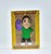Knuckleheadz Toys Astronomicon Ming Chen Vinyl Mini Figure, caricatured Ming Chen with a detailed face, wearing a green shirt, purple glove on right hand, standing with a confident pose.