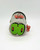 Sesame Street Oscar the Grouch Wind-Up Toy, a small gray and green wind-up toy featuring Oscar the Grouch's face with a green mouth and black eyes, with a red sign that says 'Go Away!' attached on top.