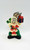 Warner Bros. 1988 Bugs Bunny Christmas Candle, festive Bugs Bunny figurine dressed in Santa attire holding gifts.