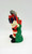 Warner Bros. 1988 Bugs Bunny Christmas Candle, vintage holiday-themed Bugs Bunny candle in festive red, green, and white colors with Christmas presents, designed for holiday decoration.