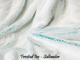A FROSTED ICE Travel Blanket, color is Saltwater Blue/Green. *DEAL