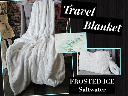 A FROSTED ICE Travel Blanket, color is Saltwater. *DEAL