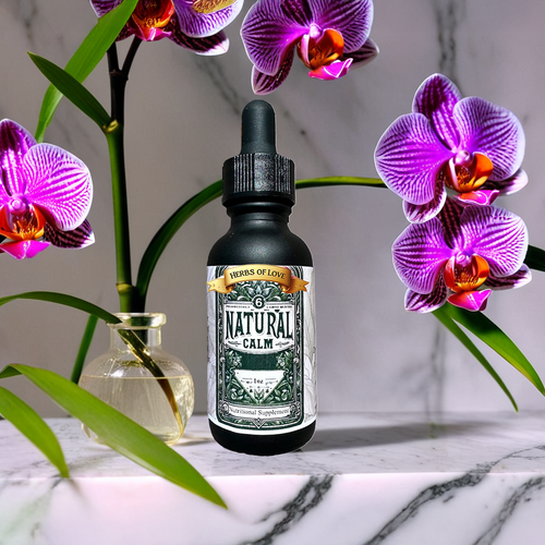 Bottle of natural calm on display with purple flowers around it