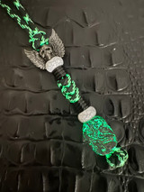 Highly Reactive Shred-Carbon Bead Knife Lanyard On Glow Cord with Black Metal Winged Skull, White Accents, and Metal Spiral Spacers
