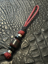 Red/Black Lava Carbon with Silver Carbon Fiber Split Bead On Red & Black Diamond Paracord Accented by Stainless and Faceted Black Spacers