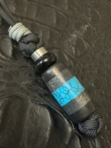 Black Carbon Fiber, Silver Carbon Fiber, and Turquoise Tru-Stone Split Bead Knife Lanyard On Black 550 Cord with Stainless Spacer, Onyx Spacer, and Gray Mini Cord Accent