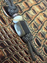 Handmade Ram's Horn & Desert Ironwood Bead Knife Nub on Black/Tan Paracord with Copper and Light Brown Accents