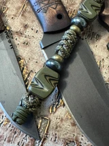 Tactical Series Black & OD Green Layered G10 Hand Sculpted Bead Knife Lanyard on Jungle Camo Paracord Accented by OD Green Mini Cord, Hematite, and Bras Spacers