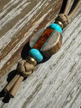 Whitetail Antler, Gold Web Turquoise Tru-Stone, and Amboyna Burl Medallion Bead Knife Nub On Coyote Tan Cord Accented by Turquoise and Polished Brass