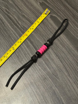 Black Paracord Shorty Knife Nub with Black Reverse Crowns, Black Faceted Beads, and Pink Metal Bead