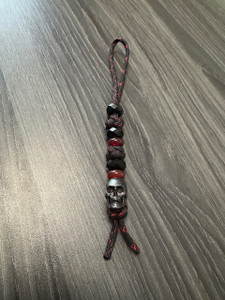 Black Faceted Bead Knife Lanyard with Large Black Metal Skull Bead On Red and Black Paracord Black Faceted Bead Knife Lanyard with Large Black Metal Skull Bead On Red and Black Paracord