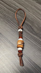 Leather Knife Lanyard with Elk Antler, Olive Wood, White Howlite, and Red Carnelian Beads Leather Knife Lanyard with Elk Antler, Olive Wood, White Howlite, and Red Carnelian Beads