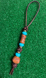 Amboyna Burl Wood Knife Lanyard with Brass and Turquoise Accents on Brown Leather Amboyna Burl Wood Knife Lanyard with Brass and Turquoise Accents on Brown Leather