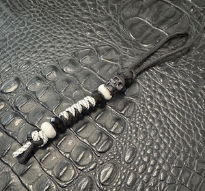 Black and White Two-Tone Paracord Knife Lanyard with Black Metal Skull Bead Black and White Two-Tone Paracord Knife Lanyard with Black Metal Skull Bead