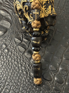 Ebony and Gold Web Tru-Stone Split Beads with Black & Brass Cross Shield and Faceted Beads on Coyote Brown Paracord Ebony and Gold Web Tru-Stone Split Beads with Black & Brass Cross Shield and Faceted Beads on Coyote Brown Paracord