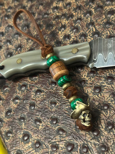 Rustic Brown Lace Leather Knife Lanyard with Handcrafted Wood Layer Bead, Malachite Spacers, and Brass Pirate Skull