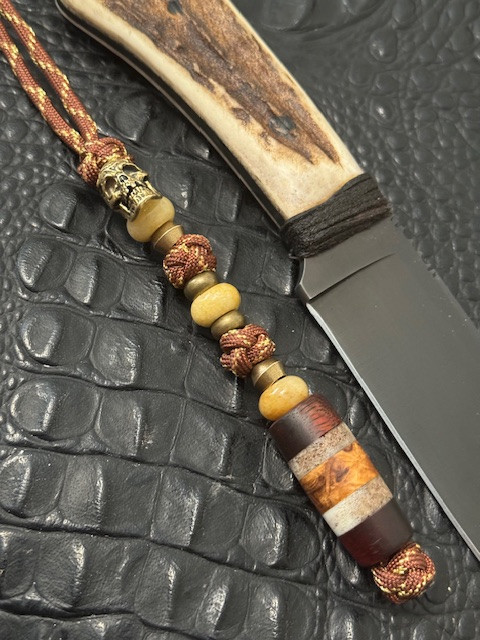 Brass All Seeing Eye Pirate Skull Bead Knife Lanyard with Handmade Koa Wood, Elk Antler, and Amboyna Burl Split Bead Accented by Yellow Jade