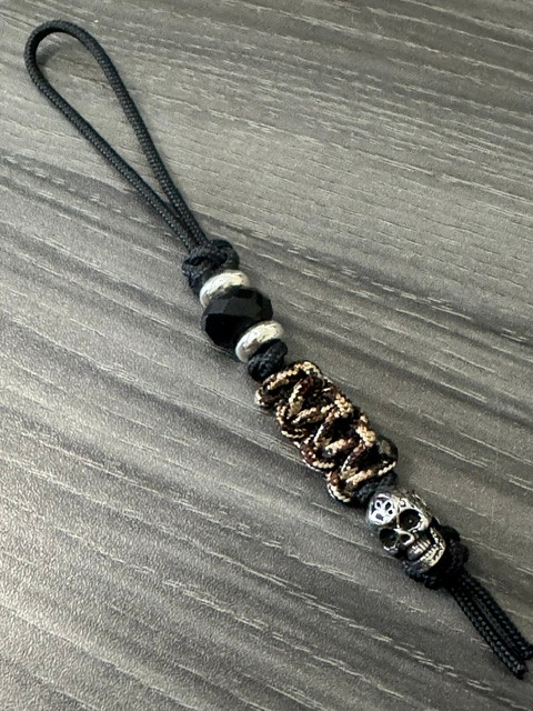 Black Mini Cord Lanyard with Woodland Camo Cobra Wrap and Engraved Stainless Skull Accented by Silver Spacers and Black Faceted Beads