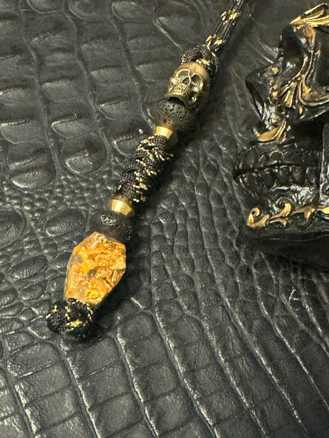 Coffin Collection Gold Flake & Shredded Money Resin Bead On Reactive Black/Gold Cord with Polished Brass Skull and Lava Rock Accents