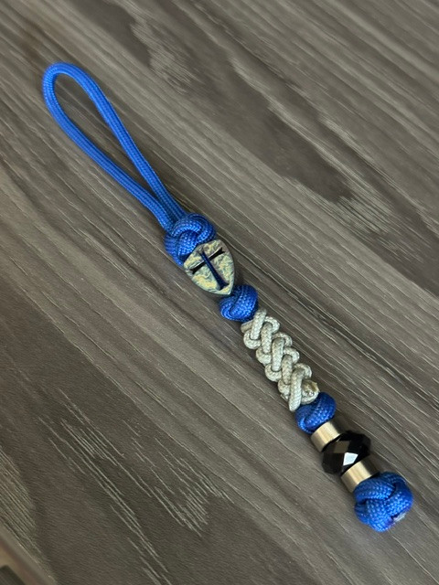 Flamed Metal Shield Cross Lanyard On Royal Paracord with Gray Mini Cord Wrap Accented by Stainless Spacers and Faceted Black Bead