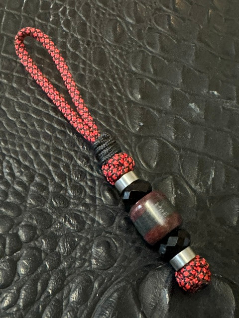 Red/Black Lava Carbon with Silver Carbon Fiber Split Bead On Red & Black Diamond Paracord Accented by Stainless and Faceted Black Spacers