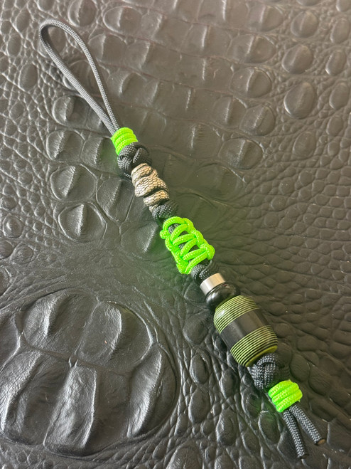 Stainless Coiled Snake Bead Knife Lanyard on Black 550 Cord with High Viz Green Mini Cord Wrap and Green/Black G10 with Black Carbon Fiber Split Bead Accented by Stainless and Onyx