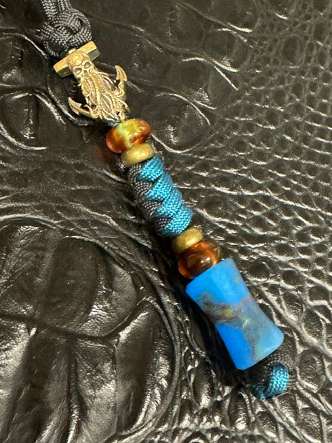 Brass Octopus & Anchor Bead Knife Lanyard with Black and Deep Teal Paracord Accented by Spindle Shaped Multi-Color Glow Resin Bead