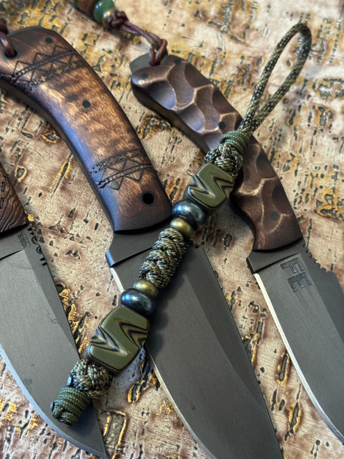 Tactical Series Black & OD Green Layered G10 Hand Sculpted Bead Knife Lanyard on Jungle Camo Paracord Accented by OD Green Mini Cord, Hematite, and Bras Spacers