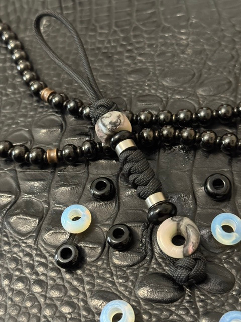 Black 550 Paracord Knife Lanyard with Mother of Pearl Infinity Bead Accented by Onyx and Stainless Spacers
