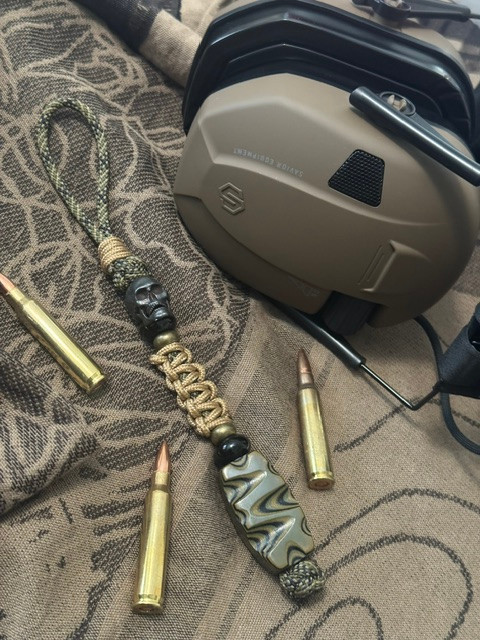 Tactical Collection Sculpted OD Green & Black Layered G10 Bead Knife Lanyard with Black Skull on Jungle Camo Paracord Accented by FDE Mini Cord Wrap, Onyx, and Brass