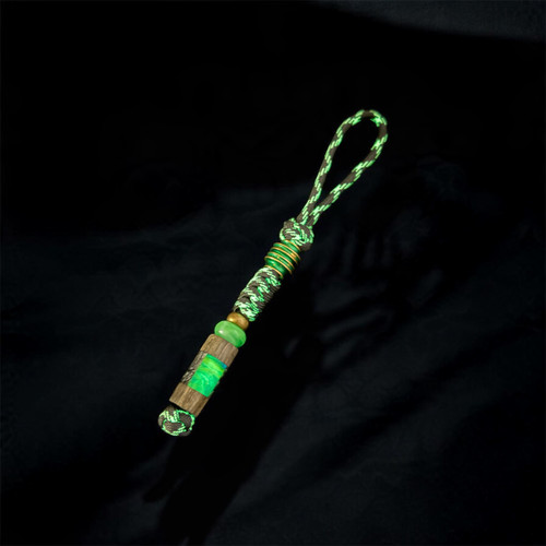 Black & White Glow In The Dark Paracord Knife Lanyard with Green Anodized Spiral Spacer and Handmade Gray Maple, Green Glow Resin, and Black/White Swirl Resin Puzzle Bead Accented by Brass & Jade Green