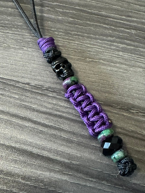 Black Mini Cord Knife Lanyard with Two-Faced Metal Skull, Purple Mini Cord Wrap, Black Faceted Bead and Multi-Color Spacer Accents