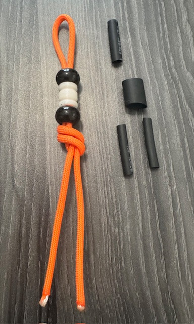DIY Knife Lanyard Kit - Hunter Orange Paracord with Glow Bead and Black Spacer Beads