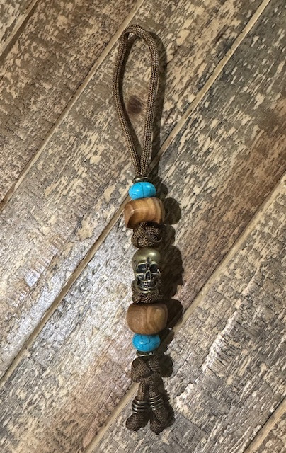 Large Brass Skull Bead Knife Lanyard with Polished Olive Wood, Turquoise, and Brass Accents On Coyote Brown Paracord