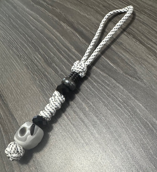 Arctic White Paracord Knife Lanyard with Black Faceted Beads and Marbled Acrylic Camo Bead
