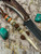Traditional Elk Tine Leather Knife Lanyard with Handmade Amboyna Burl & Arizona Jade Tru-stone Bead Accented by Yellow Jade & Brass Spirals