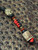Two-Tone Black and Red Lanyard with Brass Chief of War Accented by Onyx, Brass, and Gnarly Bark Elk Bead
