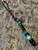 Black & Gold Paracord Knife Lanyard with One-Eyed Smoking Pirate and Ironwood/Gold Web Turquoise/Elk Antler Split Bead Accented by Brass Vase Spacers