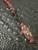 Two-Tone Red & Black Diamond Paracord Knife Lanyard with Black Skull Bead and Handmade Lava Flow Carbon Fiber Bead