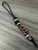 Black Mini Cord Lanyard with Woodland Camo Cobra Wrap and Engraved Stainless Skull Accented by Silver Spacers and Black Faceted Beads