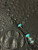 Ebony Wood, Turquoise Resin, and Silver Carbon Fiber Split Bead Resin On Black & Reflective Spec Paracord Accented by Turquoise and Black Metal Spartan Helmet Bead