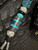 Silver Carbon Fiber, Black G10, and Black Web Turquoise Split Bead Lanyard with Arctic White Paracord, Turquoise & Black Diamond Cobra Wrap, Black Metal Skull, and Turquoise Spacers