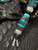 Silver Carbon Fiber, Black G10, and Black Web Turquoise Split Bead Lanyard with Arctic White Paracord, Turquoise & Black Diamond Cobra Wrap, Black Metal Skull, and Turquoise Spacers