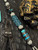 Silver Carbon Fiber, Black G10, and Black Web Turquoise Split Bead Lanyard with Arctic White Paracord, Turquoise & Black Diamond Cobra Wrap, Black Metal Skull, and Turquoise Spacers