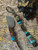 Polished Brass Skull Knife Lanyard on Black/Gold Paracord with Handmade Gold Web Turquoise & Shredded Money Resin Contour Bead
