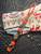 Nautical Themed Brass Octopus Skull & Anchor Bead Lanyard with Multi-Color Infinity Bead and Tan Cobra Knot Wrap Over Orange Paracord
