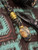 Gold Flake Resin and Shredded Money Resin Knife Nub with Polished Brass Spindle and Spacer on Black/Gold Paracord